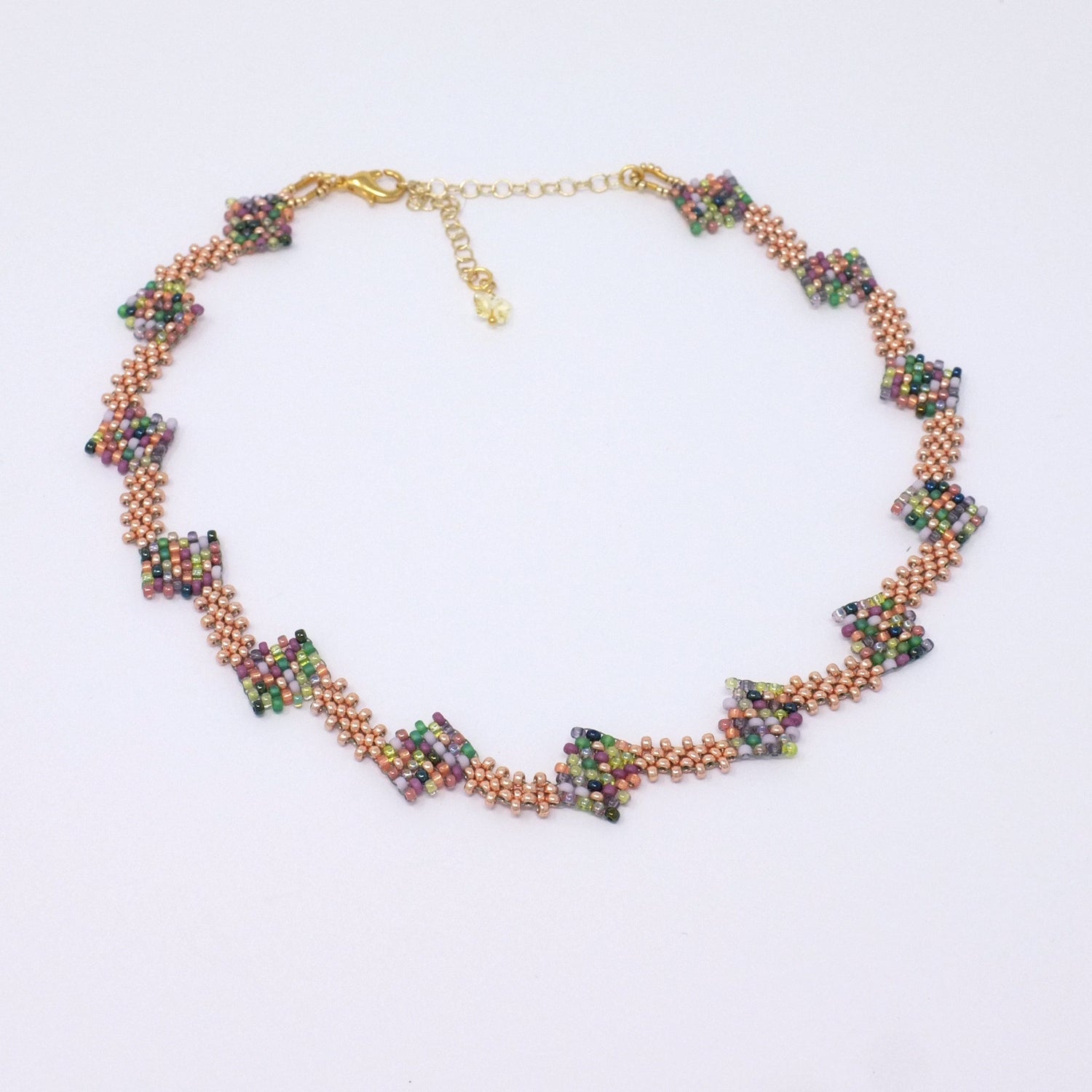 Multicolor Geometric Necklace with a dynamic design of diagonal squares.