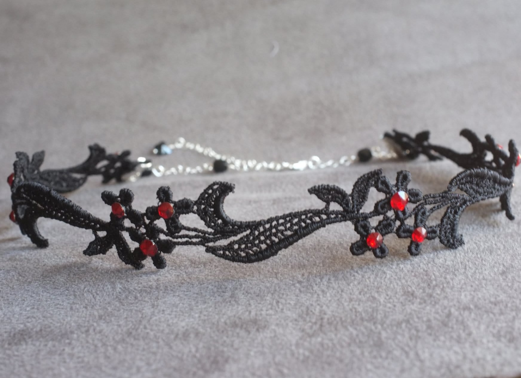 Delicate Gothic style choker made with floral black lace and red rhinestones
