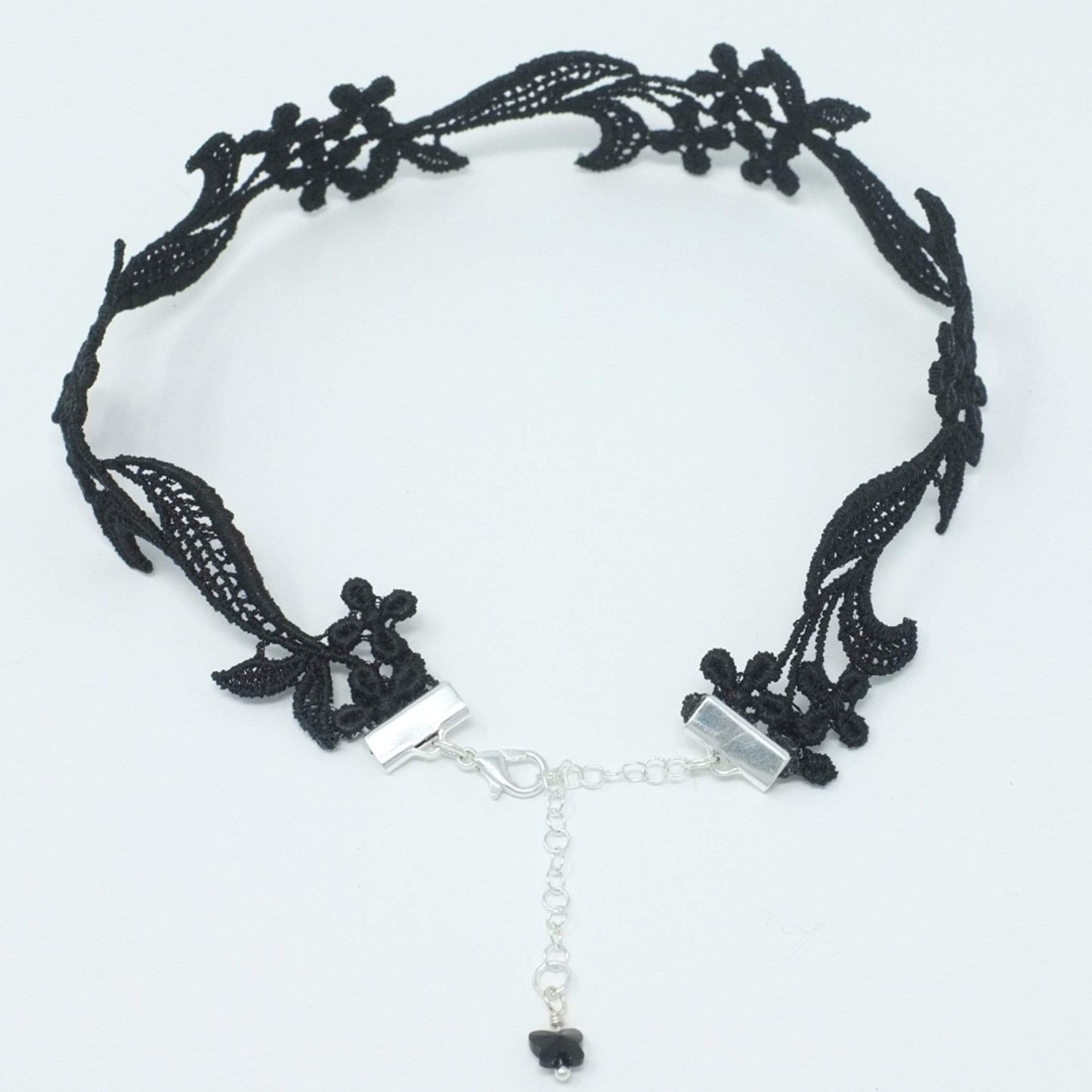 Top view of a black floral lace choker