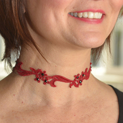 Red floral lace choker decorated with black rhinestones